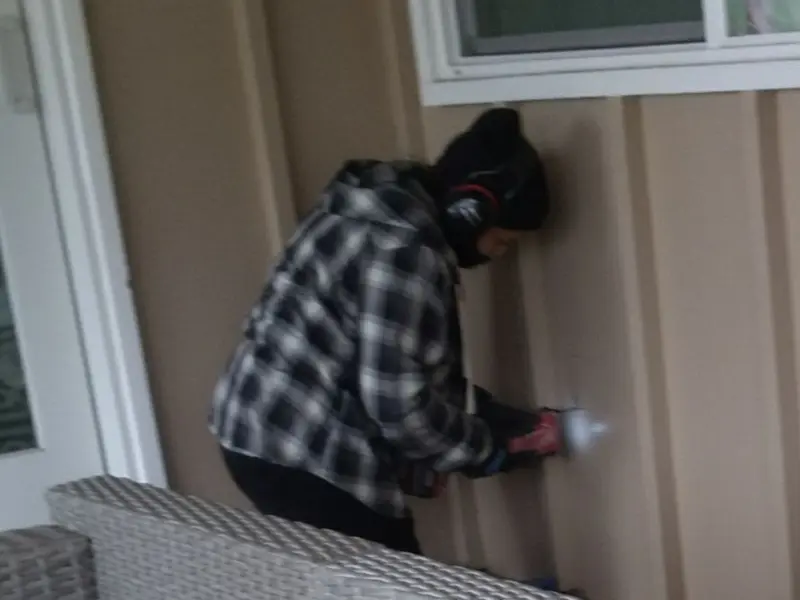 Professional electrician installing an exterior outlet in Gilbert